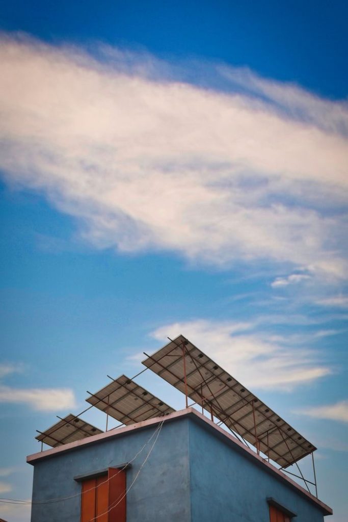 The Art of Drawing Readers In: Your attractive post title goes here Solar panels mounted on a rooftop against a clear blue sky.